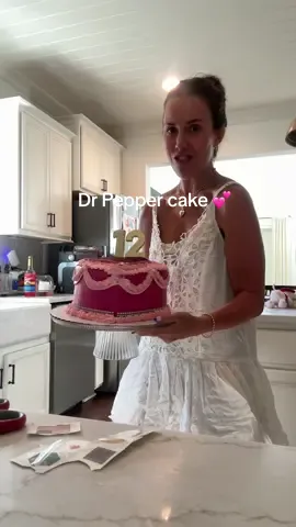 A post by @cecilybauchmann on TikTok caption: she asked for a Dr Pepper cake & she loved it 🥹🫶🏼💕I wanted it to be perfect but the top was just a bit big even with trimming the sides😭💕it was so good though walmart ftw with cutie heart cakes!!! #birthday #motherhood #momlife 