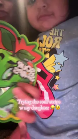 A post by @ on TikTok caption: she came back for more after so i think she liked them?😂 #fypシ #sourstrips 
