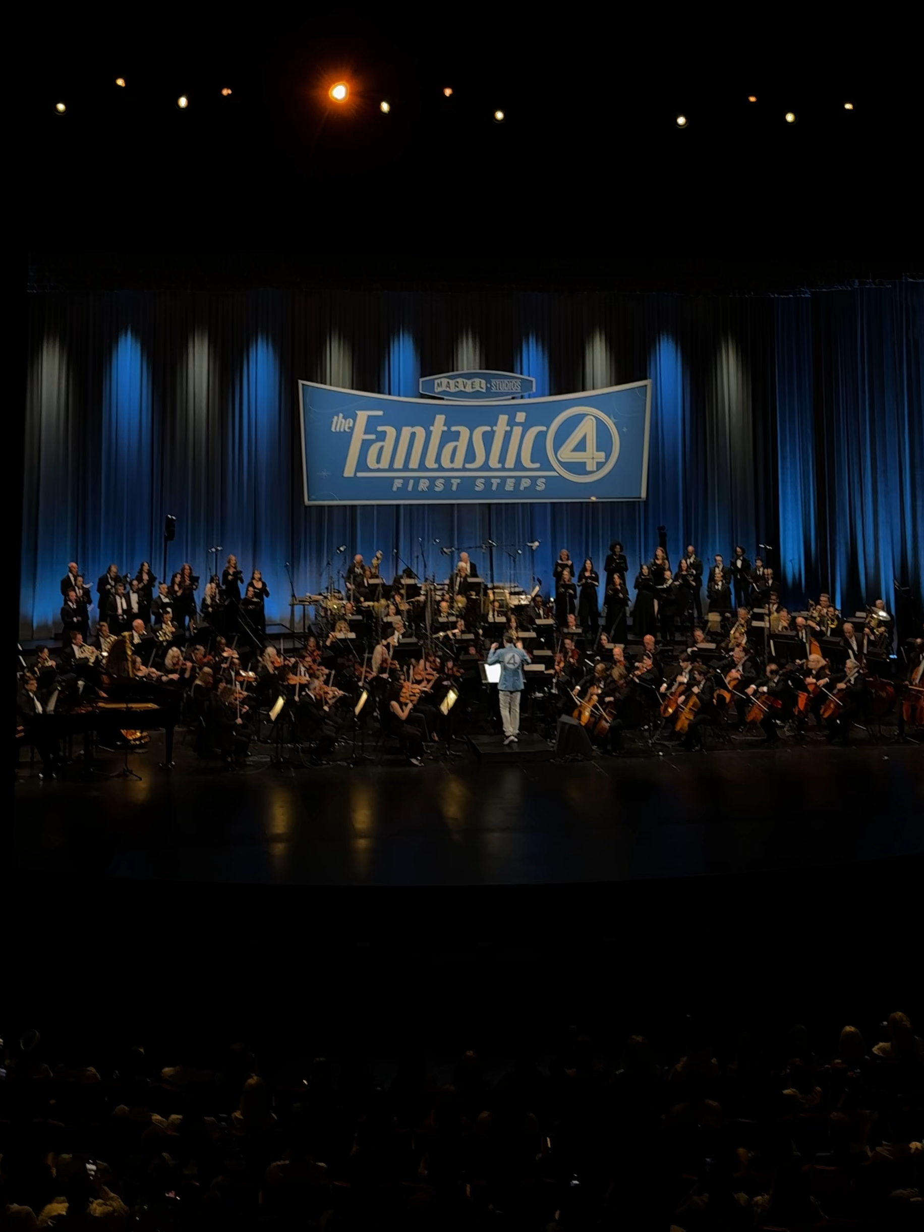A post by @marvel on TikTok caption: 🎶 FANTASTIC FOUR 🎶 Michael Giacchino kicks off #TheFantasticFour World Premiere screening with a special performance!