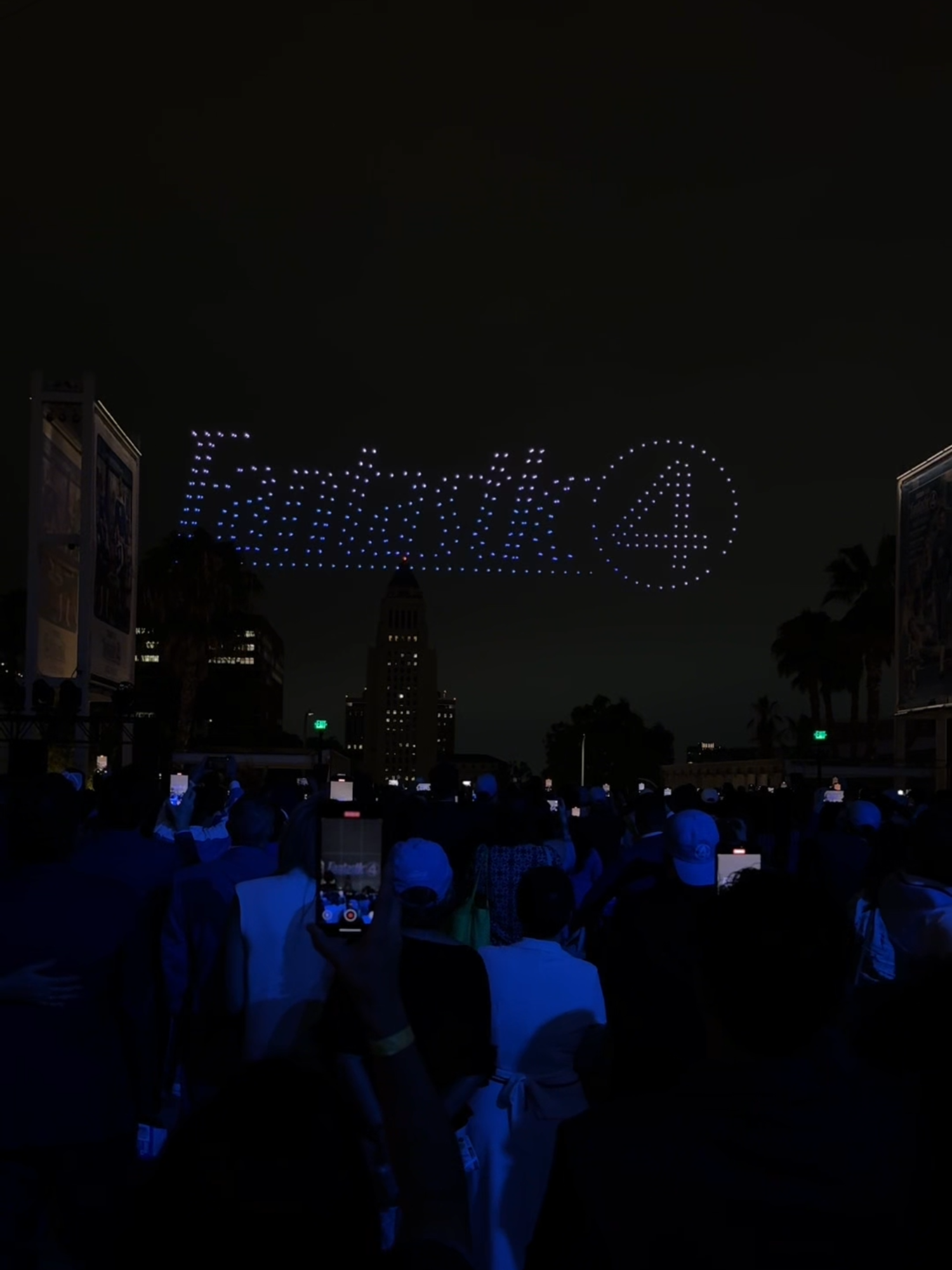 A post by @marvel on TikTok caption: #TheFantasticFour light up the sky with a drone show to end the night! ✨ This Friday, experience the film in theaters. Get tickets now.