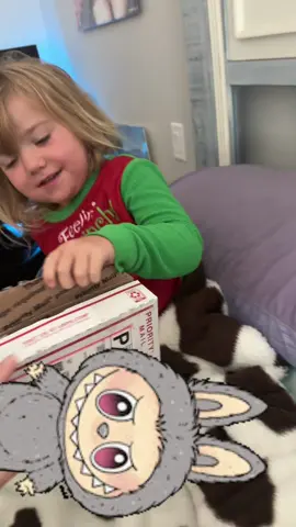 A post by @ on TikTok caption: POV: she got her labubu! Thank you so much @D a w n  she RUSHED to put it on her new Ghost Spider backpack for preschool 💜 #foryou #labubu #madeherwholeday #shegotherlabubu #foryou #viral #creatorsearchinsights 