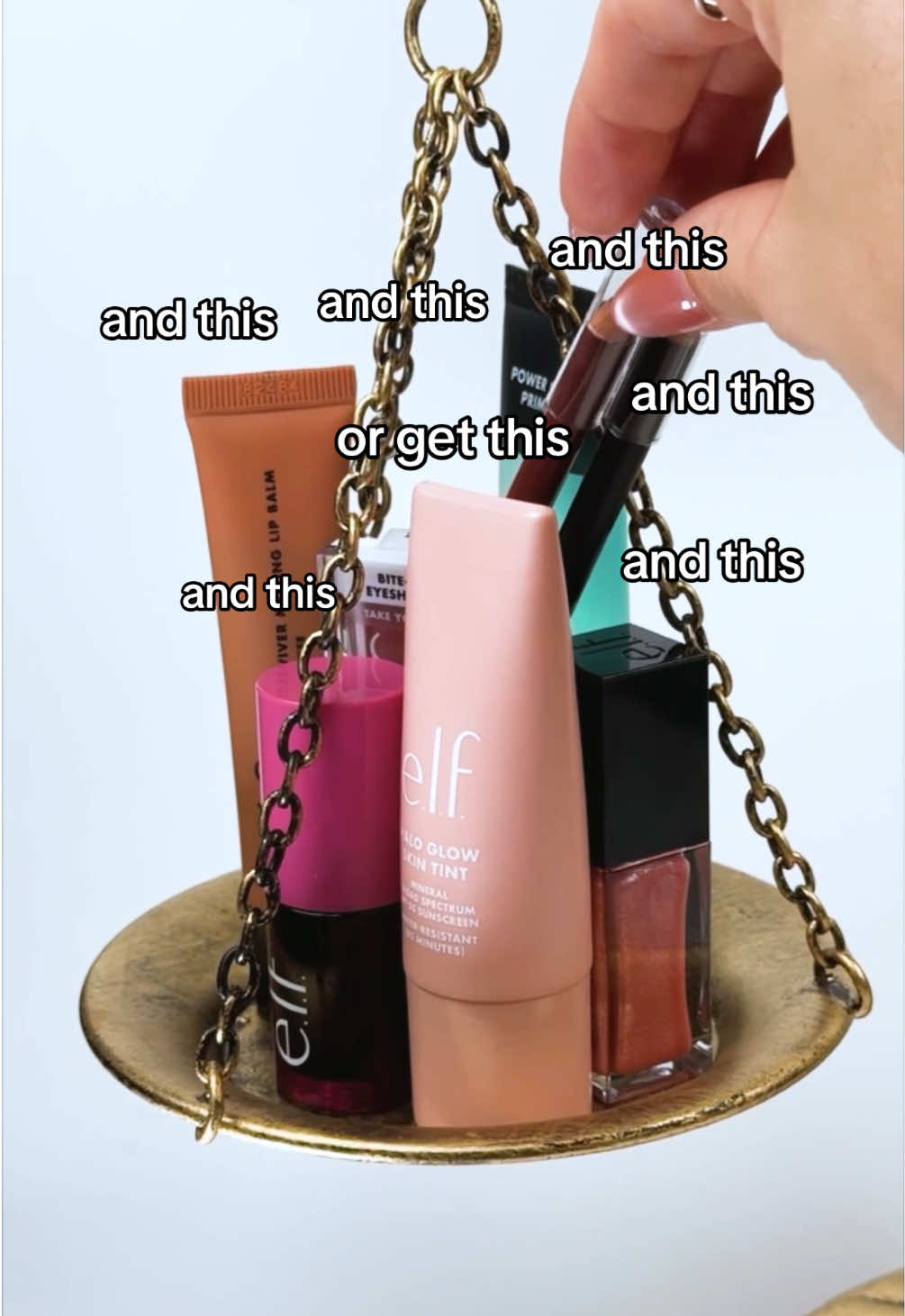 A post by @elfyeah on TikTok caption: always worth the e.l.f.ing weight in value ⚖️💗 #elfcosmetics #eyeslipsface #HaloGlowSkinTint #girlmath 