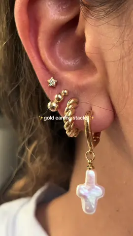 A post by @jeweledbys_ on TikTok caption: #earrings #piercings #earstack #earringstack #jewelrytour 