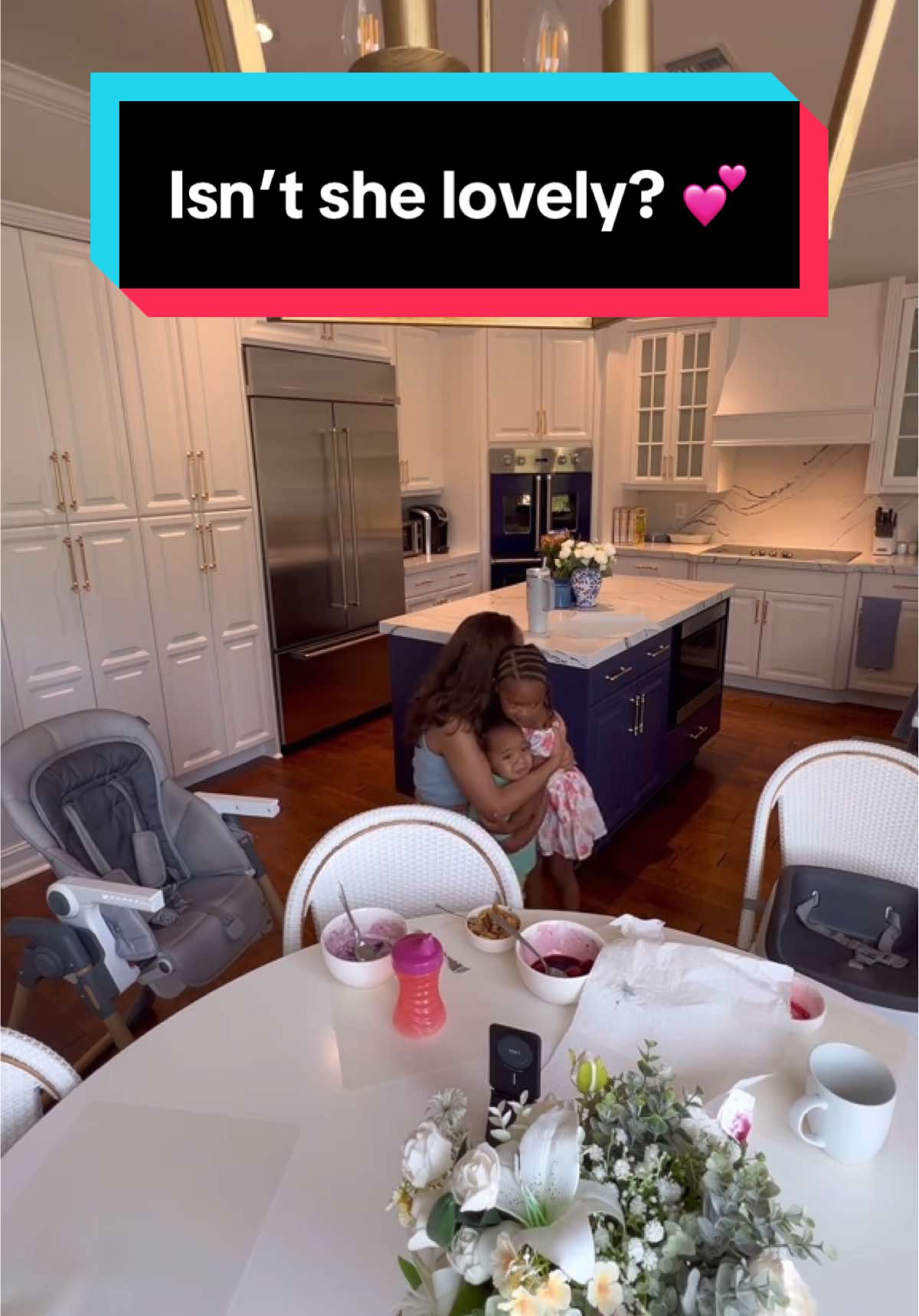A post by @janylsmithesq on TikTok caption: I sang this song to Summer in utero, on the day she was born, during this moment last year, yesterday, and countless times between. I don't care how grown she becomes—you better believe I'll keep singing it to her for the rest of my life! Also, why is Cooper so small and sweet here?! ❤️ Do you have special songs for your children? 🎶 #isntshelovely #thatsmygirl #babygirl #mamasgirl #throwback #qualitytime #specialmoments
