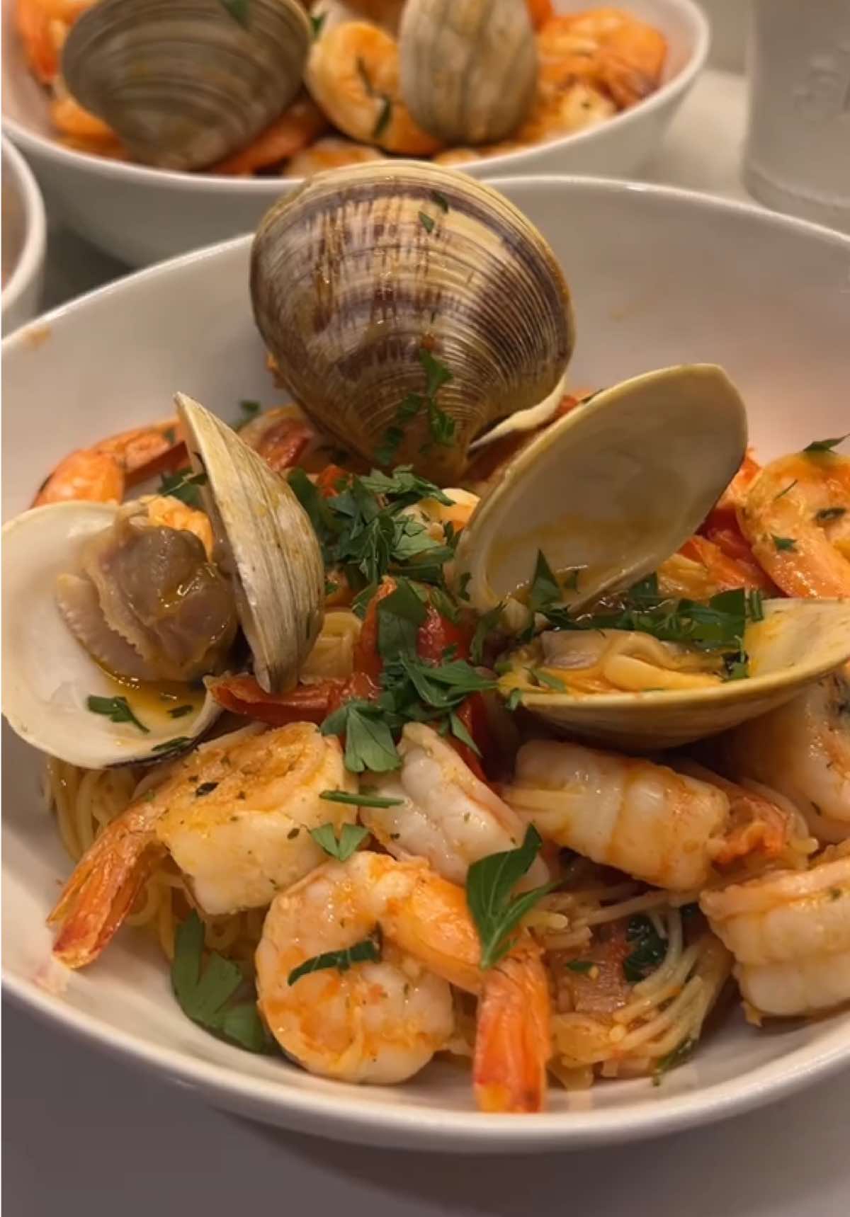 A post by @claudia.harrington on TikTok caption: Anyone remember this kitchen?🥹 #glutenfree #cookingasmr #cookingvideo #familydinner #cookingcontent #clams #shrimp #seafood #cookingforfamily 