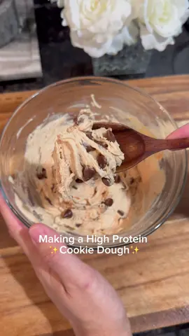 A post by @benjixavier on TikTok caption: High Protein Cookie Dough 👀💪 No baking, no BS …just a bowl of creamy, sweet protein-packed cookie dough that hits every craving 🔥 Washed mine down with a cold @Waterboy 🔥💧 Ingredients (makes 4 servings): 🥣 ¾ cup oat flour 🍦½ cup nonfat Greek yogurt 🥜 2 tbsp low-calorie peanut butter (I used PBfit!) 💪 1 scoop vanilla protein powder 🍯 2 tbsp stevia (or sweetener of choice) 🌿 1 tsp vanilla extract 🍫 ¼ cup chocolate chips Macros per serving (x4 servings): 🍽️ Calories: 175 💪 Protein: 14g 🥜 Fat: 6g 🍬 Carbs: 15g