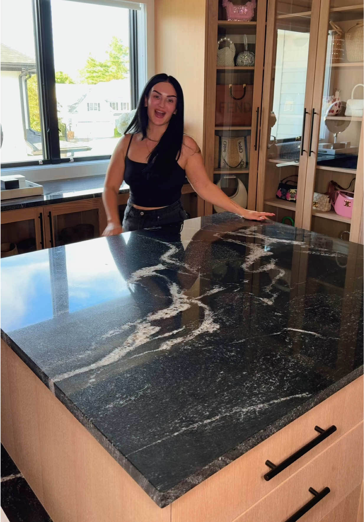 A post by @mikaylanogueira on TikTok caption: LETS DECORATE THE ISLAND IN MY WALK IN CLOSET 🌸💘🎀💄👛 #decorating #walkincloset #justgirlythings #fashion 