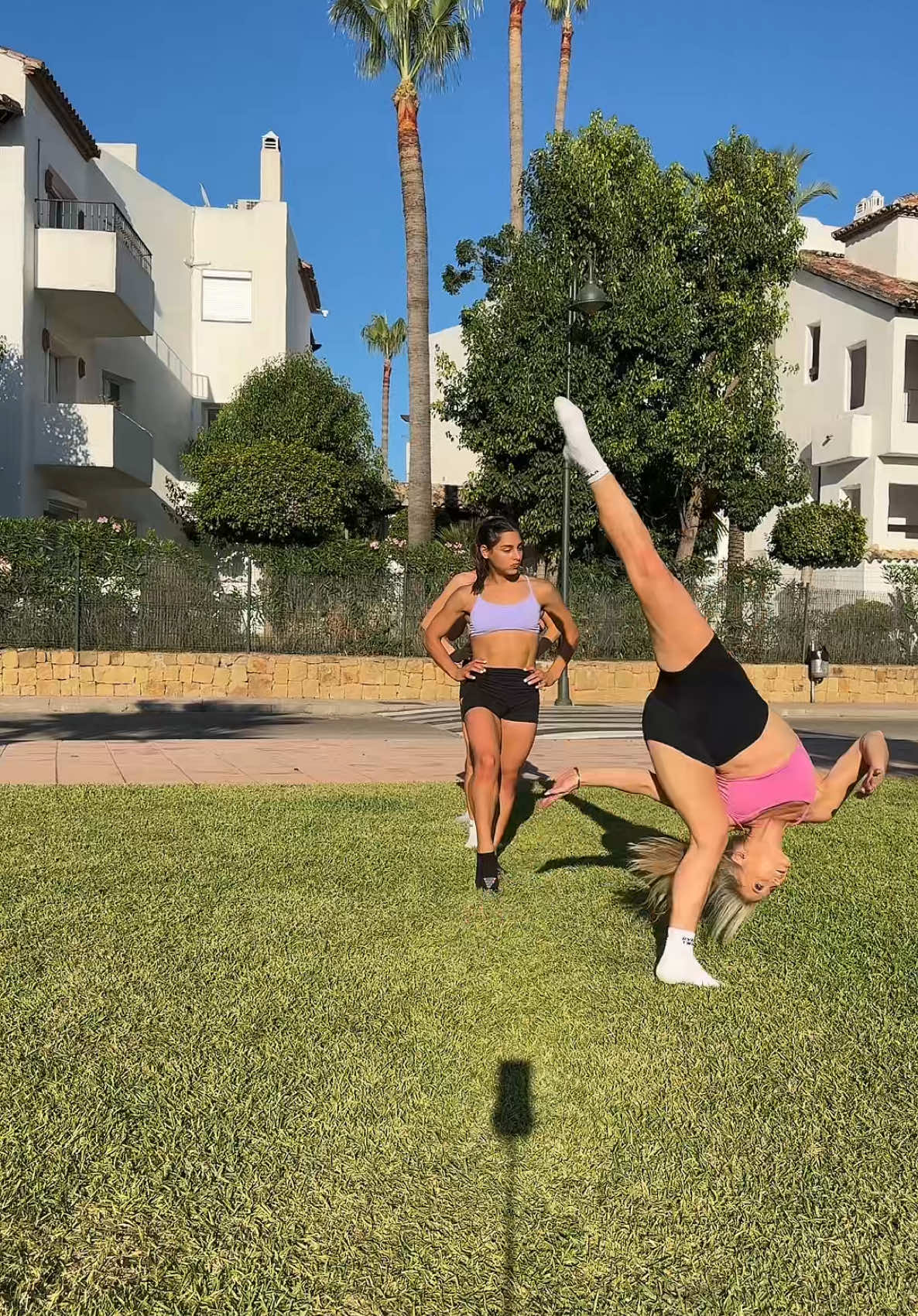 A post by @rybkatwinsofficial on TikTok caption: The tripod is giving the most attitude 🤣 #twins #sisters #attitude #rybkatwins @mmgymsisters 🩷💜 