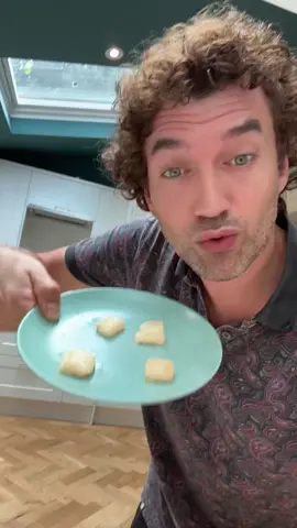 A post by @theitalianfoody on TikTok caption: Replying to @bookworm Microwave Parmigiano Pops