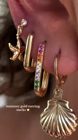 A post by @jeweledbys_ on TikTok caption: #earrings #piercings #earstack #earringstack #jewelrytour #jewelry #goldjewelry #jewelrystack 