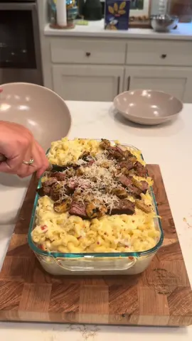 A post by @tylergrowthlife on TikTok caption: Surf & Turf Mac n’ Cheese on the back patio #vlog #cookingvlog #DayInTheLife #lifestylevlog #backpatio #backyardvibes #blackstone #outdoorcooking #fyp #steak 