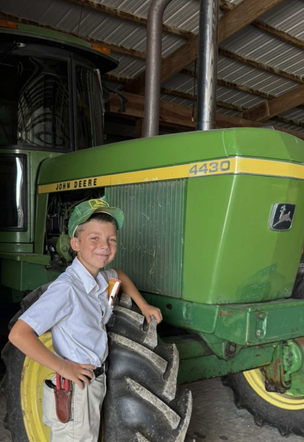 A post by @justajacksonthing on TikTok caption: Jackson was excited to win this @John Deere Waterloo boy precision collection 1/16 scale tractor to add to his collection #justajacksonthing #makefarmingfun #farm #farmlife #futurefarmer #oldschool 