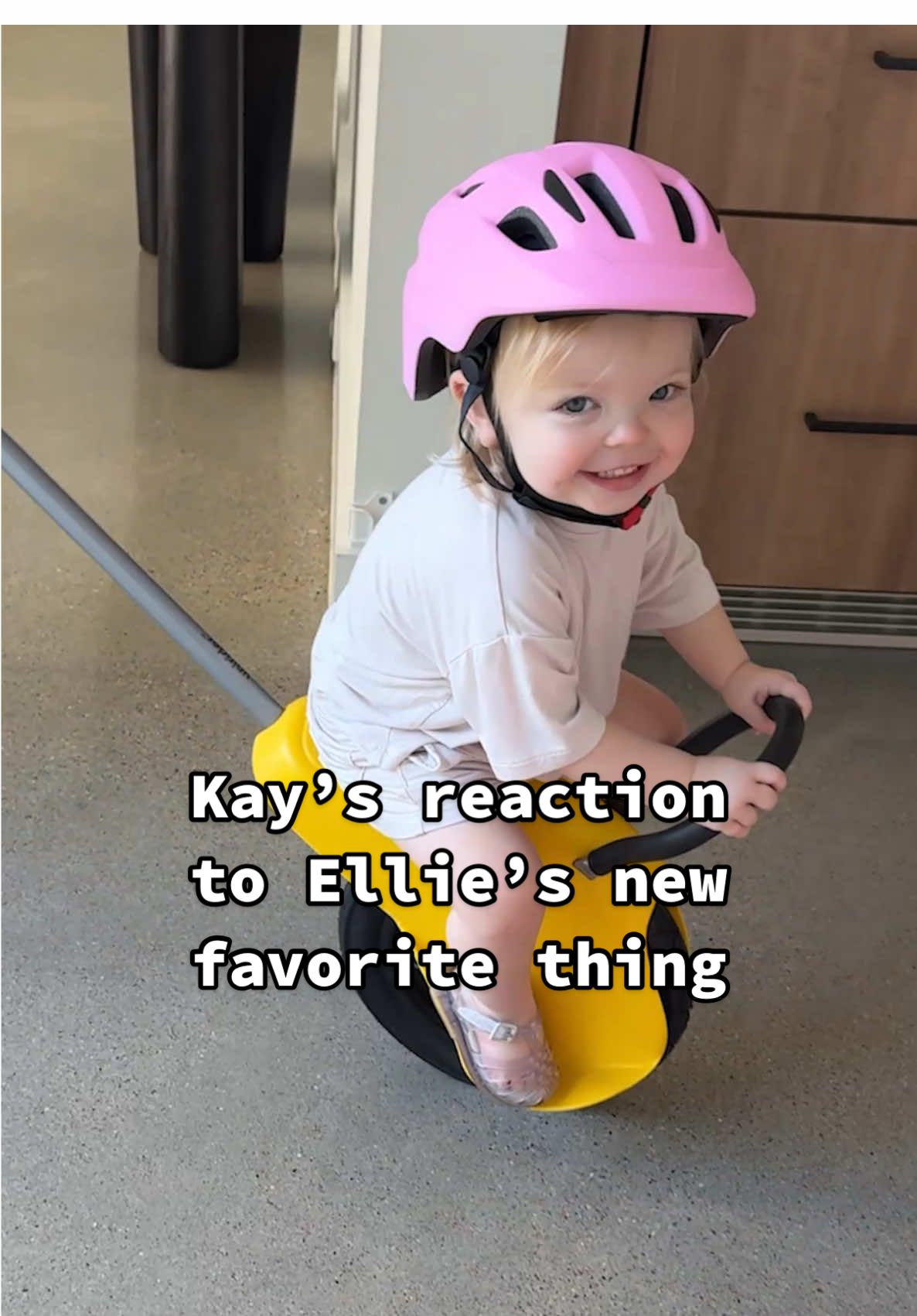 A post by @kayandtayofficial on TikTok caption: How was she so good at it! 😳😂 backstory ::: I saw this little thing that you can use for walks and playing outside, so I got one to surprise Ellie! I built it and went to get them. Kay was so confused at first and thought it was a weed eater, but then I showed her how it worked and she was so excited for Ellie! Ellie was instantly happy. She loved riding around! We took it outside and went on an adventure! 😂 it was so fun watching Ellie ride around outside. I am glad we have this, because now we can go on little one wheel adventures more often 😂🥹 #kayandtayofficial #couples #relationships #pregnant #postpartum 