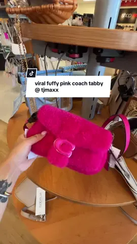 A post by @designedbycarissa on TikTok caption: found the pink fluffy coach tabby at tjmaxx, I did not need her but she was super cutie 💕 #tjmaxx #tjmaxxfinds #shoppingvlog #coachtabby #coachbags 