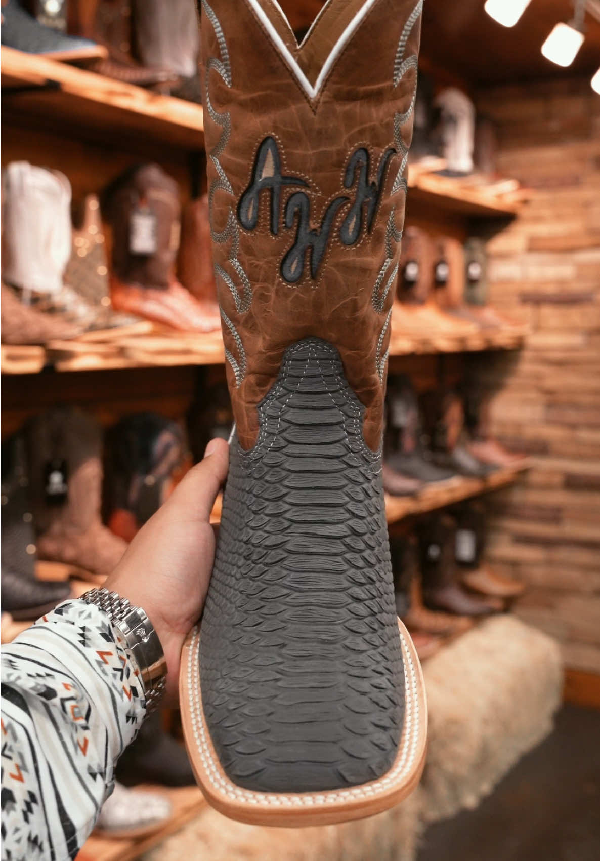 A post by @alfawesternwear on TikTok caption: How Clean Are These Matte Gray Pythons 🐍🔥😮‍💨 #alfawesternwear #alfawesternwearboots #python #texas #cowboyboots #westernwear #cowboyshit #botasvaqueras 