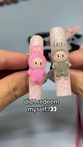 A post by @mooyahyah on TikTok caption: Replying to @💞proud min su lover 🫰 labubu nail charm attempt number 2