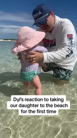 A post by @shelbanddyl on TikTok caption: He got real protective at the end 🤣 #shelbanddyl #beach #baby #couples #relationships 