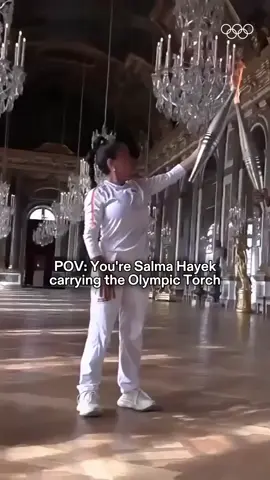 A post by @olympics on TikTok caption: Look at Salma Hayek owning it. 💅 #Olympics #Paris2024 #Sports #TorchRelay