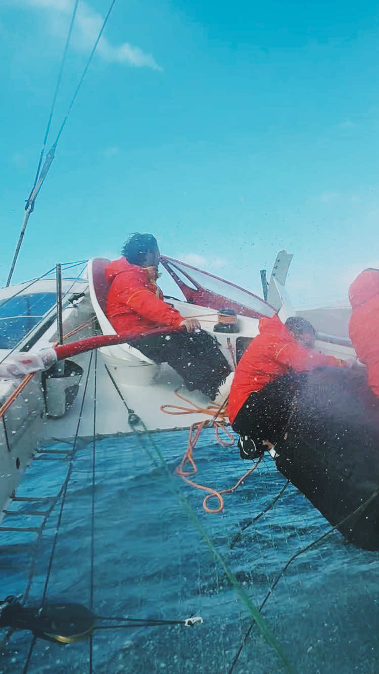 A post by @ferrari on TikTok caption: When two worlds collide 🤝 Giovanni Soldini, Ferrari Hypersail Team Principal, takes Raffaele de Simone, Vehicle Test Driving Development Manager, on his first voyage at sea, giving a taste of what's to come. 🌊 #FerrariHypersail