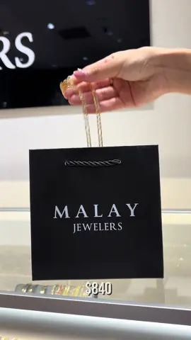 A post by @malayjewelers on TikTok caption: Bags for his and her’s! Buy now, pay later options available. Dm us to shop. You can visit us in store, open 7 days a week! 📍