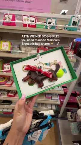A post by @designedbycarissa on TikTok caption: not a weiner dog girlie, but I am a dog lover & this bag charm was too good to pass up 🐶 giving sticky zoo leather bag charm vibes, but at marshalls 👏🏼 #marshalls #marshallsfinds #shoppingvlog #weinerdogs #bagcharms 