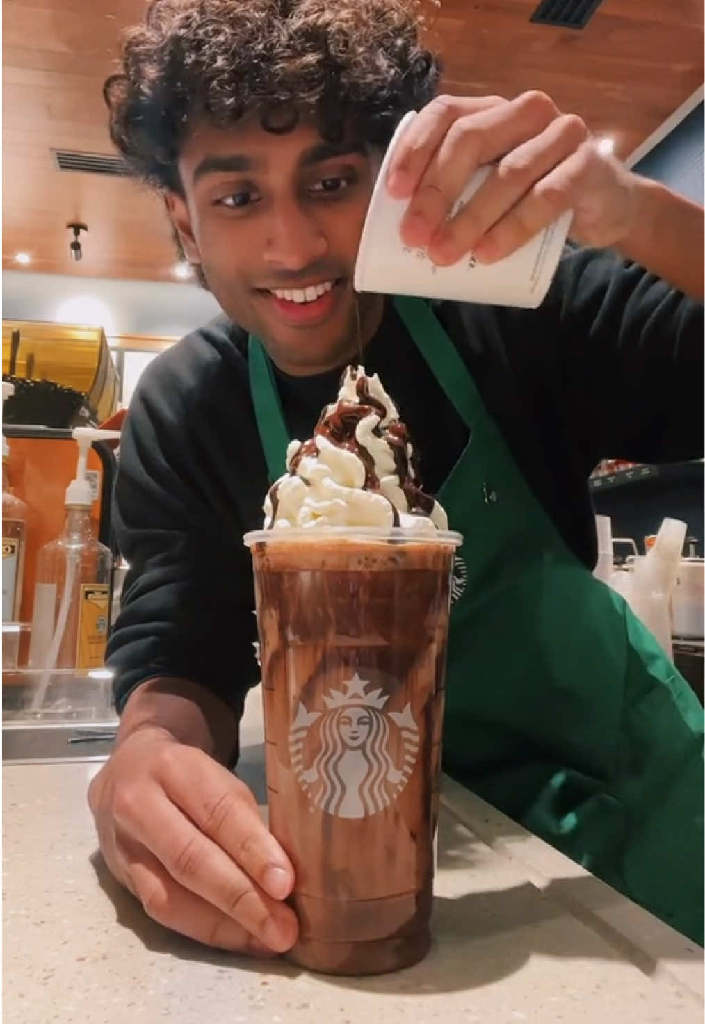 A post by @itsjoboi on TikTok caption: Iced Hot Chocolate is so DELICIOUS at Starbucks!🔥 #fyp #Viral #trend #starbucks #indian #barista #brown 