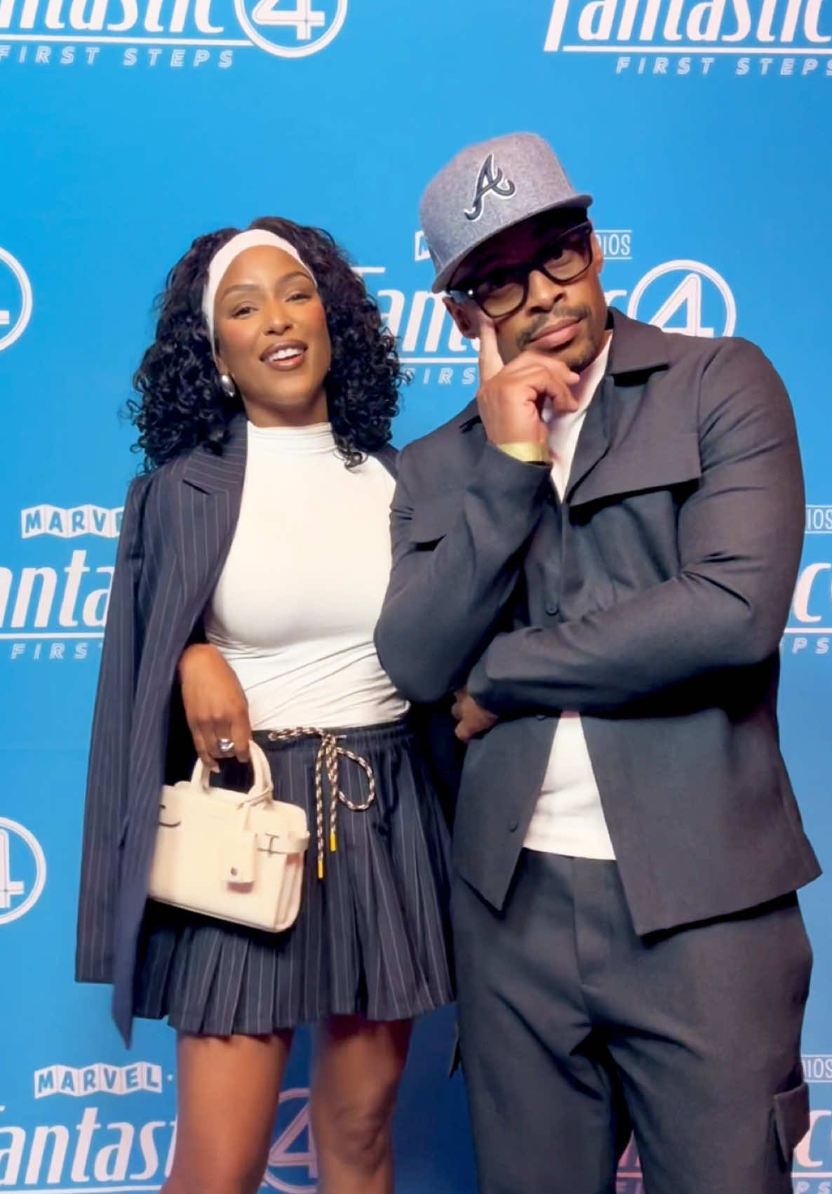 A post by @latoyabruh on TikTok caption: Made him match with me. He said yes like he had a choice. 😂💙🫶🏽📸 #fitcheckfashion #fitchecks #fitcheck #blacklove #fyp @Slick TwoThree #fantasticfour  Blazer/skirt: @THE UPSIDE  Top: @Amazon Fashion  Heels: @stevemadden  Bag: @Le Tanneur  Slick’s fit: @Manière De Voir 