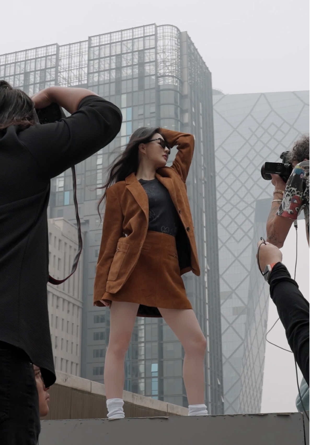 A post by @coach on TikTok caption: #XuLu makes it look effortless✨ #CoachNY #CourageToBeReal #qotd #bts #behindthescenes