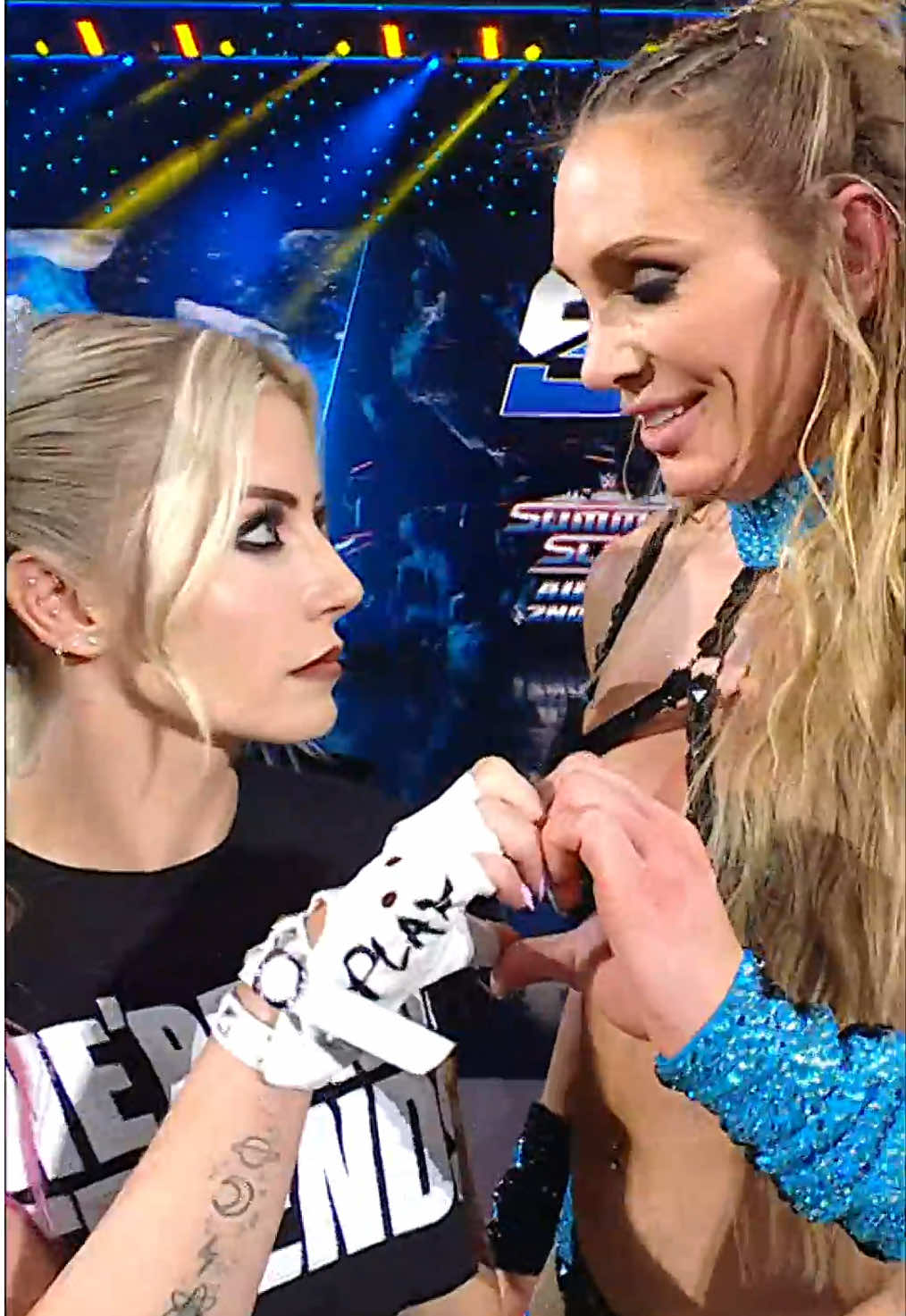 A post by @wwe on TikTok caption: alexa 🫶 charlotte #WWE #AlexaBliss #CharlotteFlair 