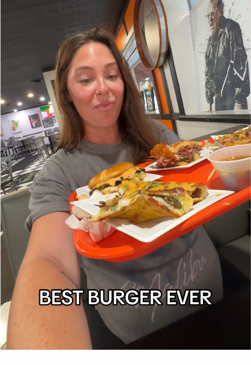 A post by @katiesantry on TikTok caption: That best burger ever feeling ✨🍔 @Bro Man's Sammiches in Erie PA is truly a must.  #mukbang #eatwithme #burger #pastrami #comewithme 