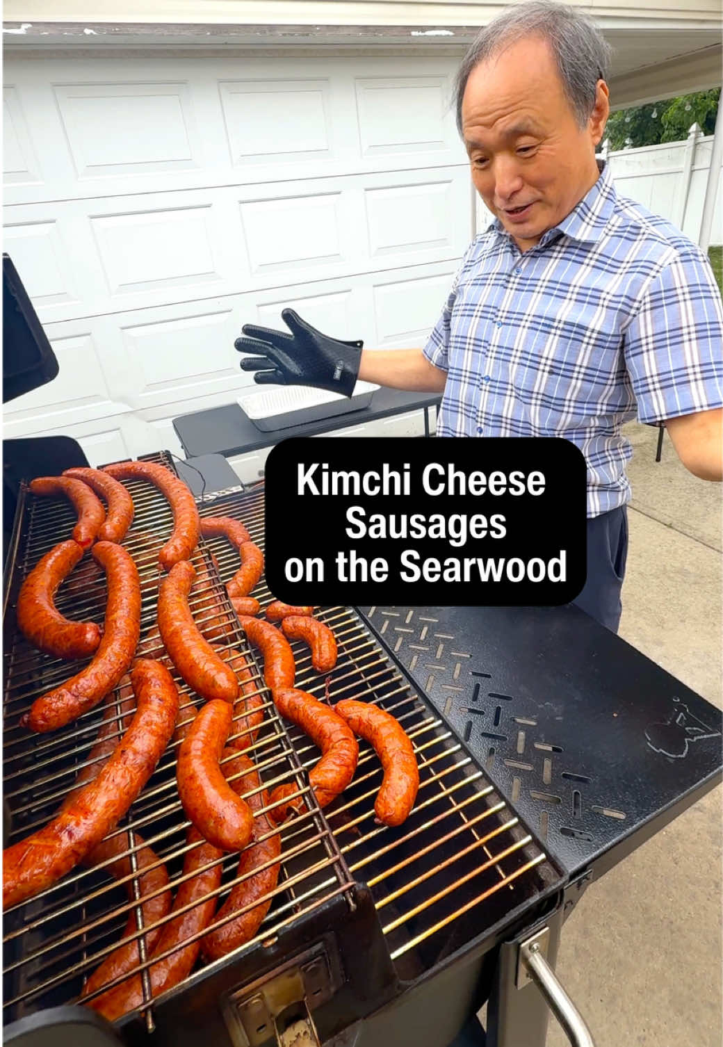 A post by @crazykoreancooking on TikTok caption: Dad always LOVED sausages even when he lived in Korea. So he was super excited to make his own version, kimchi cheese sausage, for the first time. Thanks to @Webergrills Searwood Wood Pellet Grill, he was able to smoke the sausages while getting a massage 😂. Mom made scorched rice with a mix of rice and sweet rice on the griddle insert. Then, Dad finished the sausages by grilling it briefly to add a delicious char. The sausages were perfect with a flavor explosion of kimchi and cheese with a hint of apple wood and a spicy kick from chili peppers.  #Webergrills #weber #webersearwood #searwood #pelletgrill #pelletsmoker #bbq #grilling #griddle #koreanfood #koreanrecipe #kimchi #sausage #sausagerecipe #ad