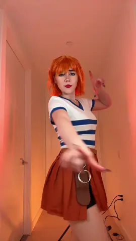 A post by @swaggy_cucumber on TikTok caption: Bet you didn’t see that coming😼 | I’ll be wearing her tomorrow for the Miniso event eee! #onepiece #nami #Cosplay #namicosplay #thief 