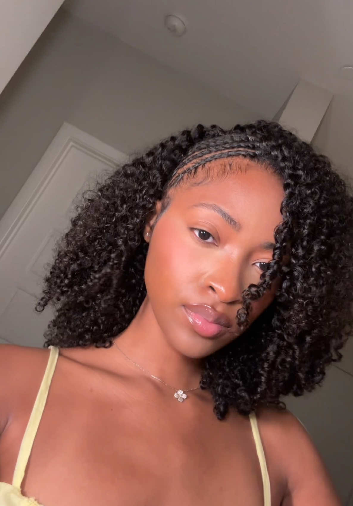 A post by @xoalyria on TikTok caption: This was a cute lil 1 2 #fyp #halfwig #wiginstall #braids #braidstyles 