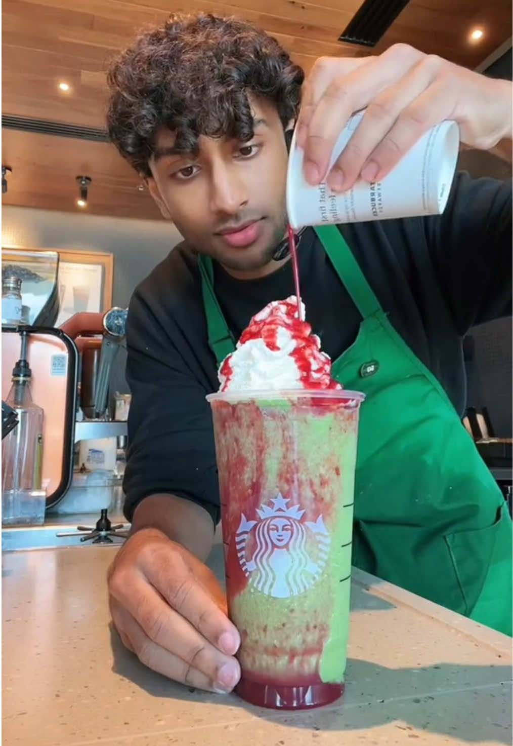 A post by @itsjoboi on TikTok caption: Mario & Luigi Frappuccino gets me the W against bowser🔥 #fyp #Viral #trend #starbucks #indian #barista #brown 