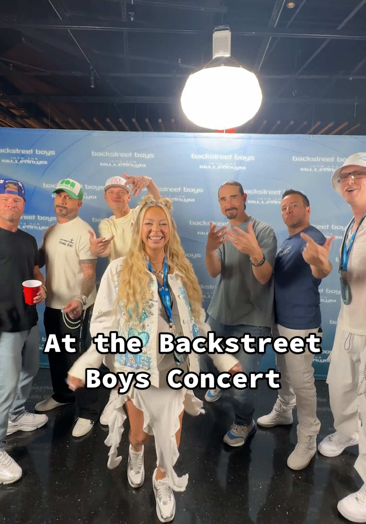 A post by @kayandtayofficial on TikTok caption: The amount of times I had to rewatch this to see everyone’s reaction! 🤩🩵🤍 #kayandtayofficial @Backstreet Boys (IB: @meredith bell. 🛎 )
