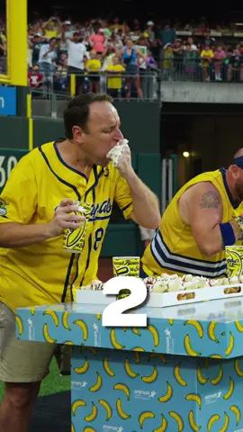 A post by @thesavbananas on TikTok caption: The 17x Hot Dog Champion took on a new challenge tonight. Joey Chestnut became the first official Banana Dog champ in front of a sold out crowd in Philadelphia. 💪 What is a Banana Dog you ask? Aramark created a sweet spin on the classic dog for our fans this season, complete with a banana, whipped cream, strawberries, and chocolate. 😋