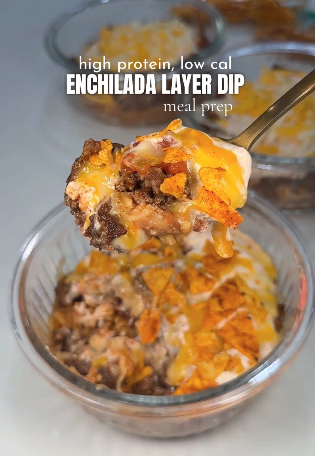 A post by @makayla_thomas_fit on TikTok caption: Replying to @Michele Brewer718 high protein layer dip to get us ready for the week 👏🏼 dip with chips or crush on top 🔥 #healthymeals #mealprep #highproteinmeals #lowcalorie #healthylunches