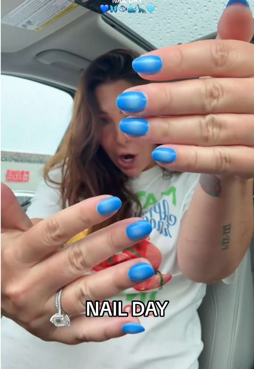 A post by @katiesantry on TikTok caption: Could these be my last nails before baby?! 💙🩵 #bluenails #nailinspo #auranails #nailart #nailtransition 
