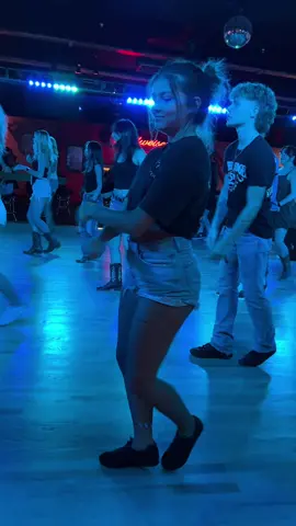 A post by @electriccowboylewisville on TikTok caption: Country Girl Twerk @Chelsea🫧 #eclewisville #texas #texascheck #linedancing #linedancersoftiktok #hotgir🔥💋 #texasgirl❤️🤍💙 #fyp #party #trending #popular #dfw #dallastx #dancethenightaway #countrybar 