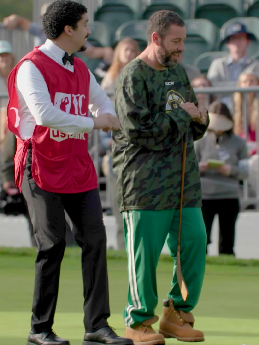 A post by @netflixisajoke on TikTok caption: teaching Sandler to salsa #HappyGilmore2
