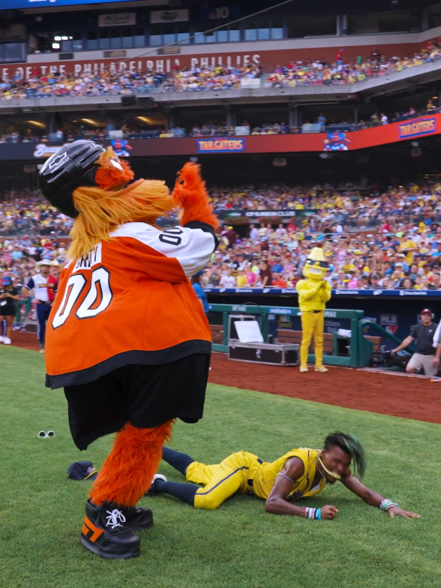 A post by @thesavbananas on TikTok caption: don't mind @grittynhl and @dance_izm3 coming in like a wrecking ball🤭 #savannahbananas #bananaball #gritty #flyers
