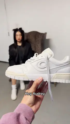A post by @coach on TikTok caption: @audreynuna says she uses her Soho Sneakers for what? 👀 Comment if you’d wear her creation…👟 #CoachNY #MoreThanWalking
