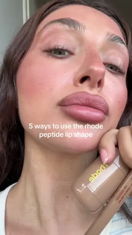 A post by @vanessanicolestern on TikTok caption: Contour, fill in, with a pocket blush, with a lip treatment, paired with a lip liner @rhode skin 