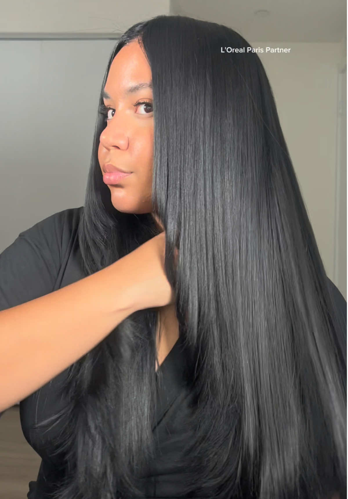 A post by @ on TikTok caption: Elvive Glycolic + Gloss line is Gloss queen approved ✨ @loréal paris usa  #LOrealParisPartner #LOrealParisHairCare #GlossyHair #HairTok #Haircare