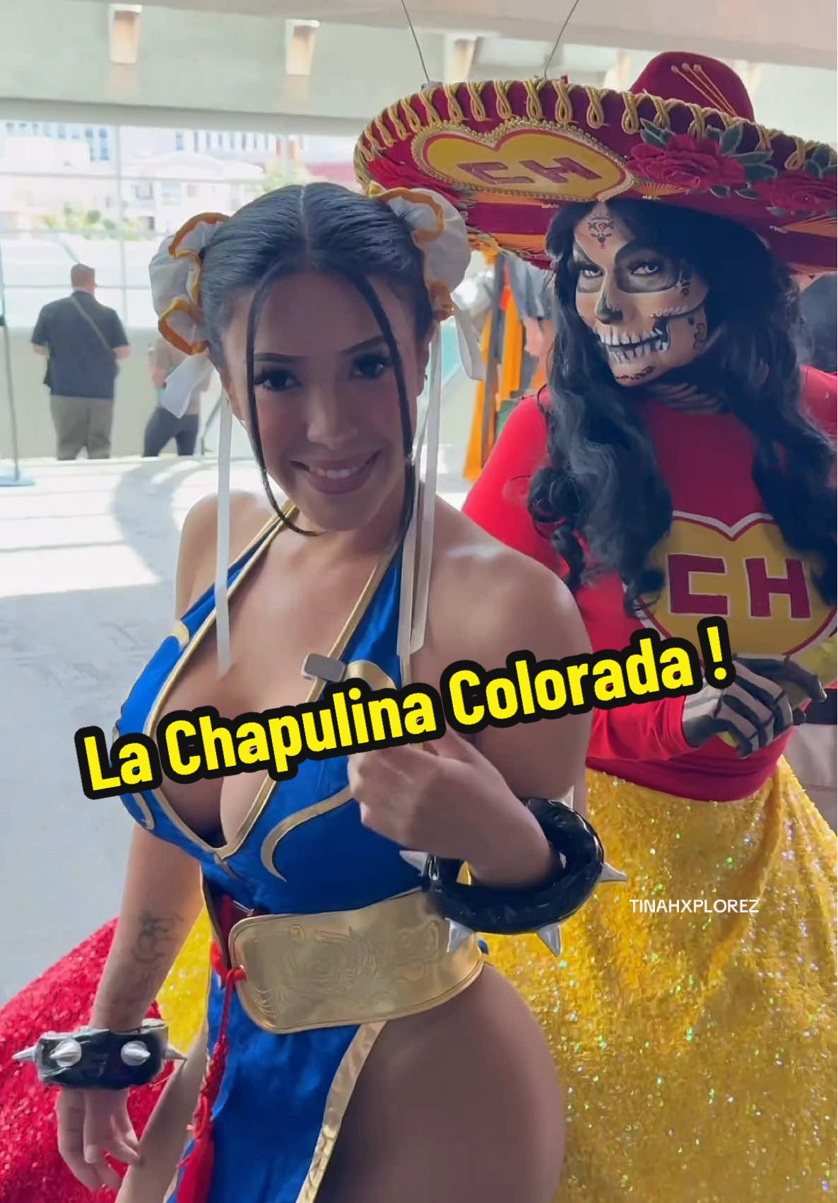 A post by @tinaexplorez on TikTok caption: Chun-Li meets La Chapulina Colorada!! #onthisday #sdcc #viral #cosplay #chapulincolorado #sandiego #fantastic4 #fortnitechunli #fakebody 