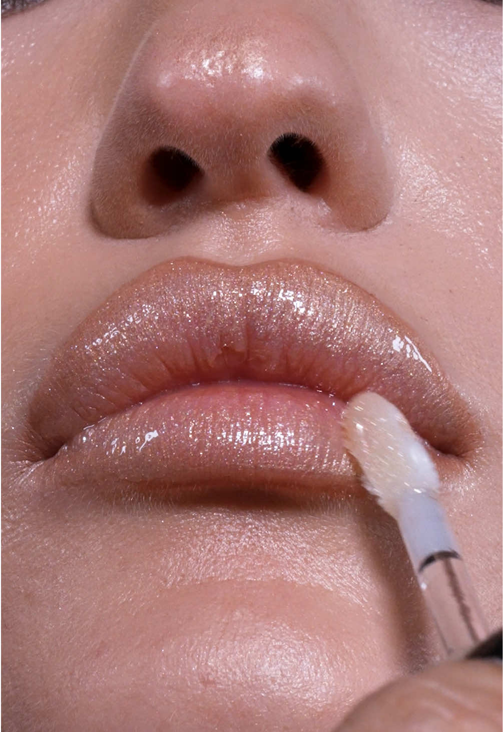 A post by @natashadenona on TikTok caption: #NDLipCombo GOLDEN SUMMER LIPS ft. my HY-GEN GLOW BEAUTIFIER + I NEED A NUDE Lip Crayon in shade Cleo +  GOLDEN GLIMMER GLOSS  👄 #makeupbynatashadenona #explore #natashadenona #lipcombo  