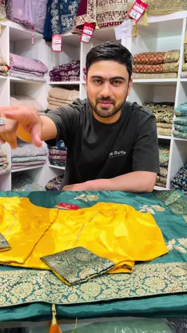 A post by @fabeha_sarees on TikTok caption: Behold, a masterpiece woven in dreams!  This ethereal saree, adorned with a shimmering gold Bamarsi border that gracefully cascades through the edges and palu, is a symphony of elegance. Exquisite embroidery motifs dance across the fabric, creating a mesmerizing spectacle. Crafted from luxurious fabric, it boasts a sumptuous silk finish that drapes effortlessly. This saree is perfect for those unforgettable moments that deserve a touch of magic.  #partywearsaree #tiktokmademebuyit #sareelover #weddingsaree #fyp 