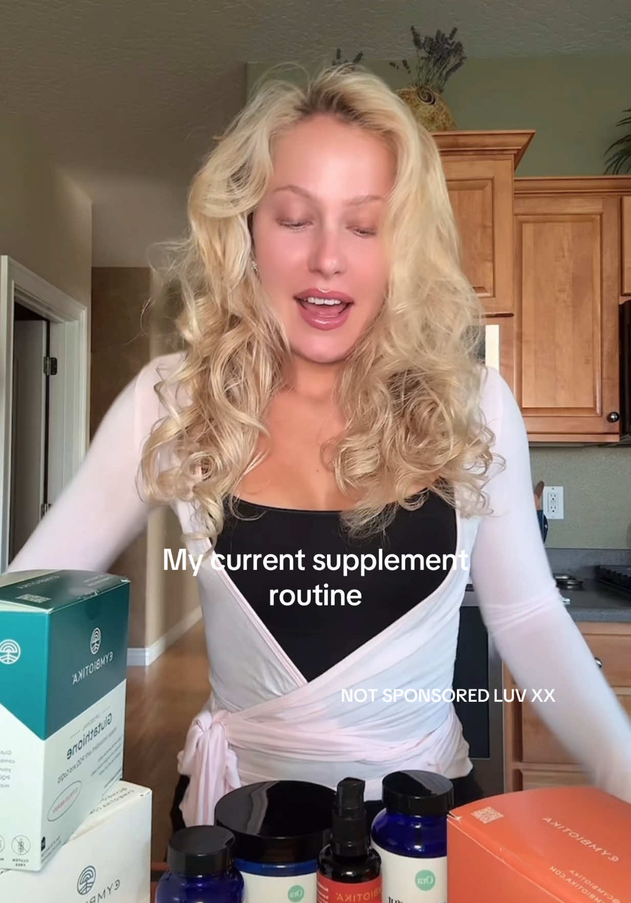 A post by @natalyatoryanski on TikTok caption: The D3 + B12 in the morning makes me feel SO ENERGIZED The only 2 brands I’m using: @Ora Organic  @Cymbiotika  Top @exercere  Shorts @Aritzia  Tank @ShopCosabella 