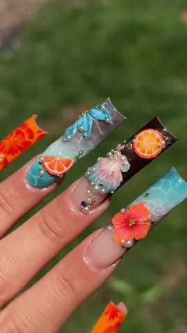 A post by @sulysnailography on TikTok caption: The sound makes me feel like I’m under water 😌 Freestyled by me ✨   Using @Ballpit Nail Art Products c0de 𝗦𝘂𝗹𝘆 to save 🩵 -creature feature -pumpkin juice  -mango smoothie (paint balls) -bedazzle gel -unicorn white fantasy clay -twice as nice brush -beginner baddie  Puka shell was inspired by txmanimuse on ig✨ #fyp #summernails #nailinpo #nailideas #3dnailart #3dnails #pukashellnails #pukashell #orangenails #acrylicnails #xlnails #nailtok #3dflowersnails #watereffectnails #shellnails #seashellnails 