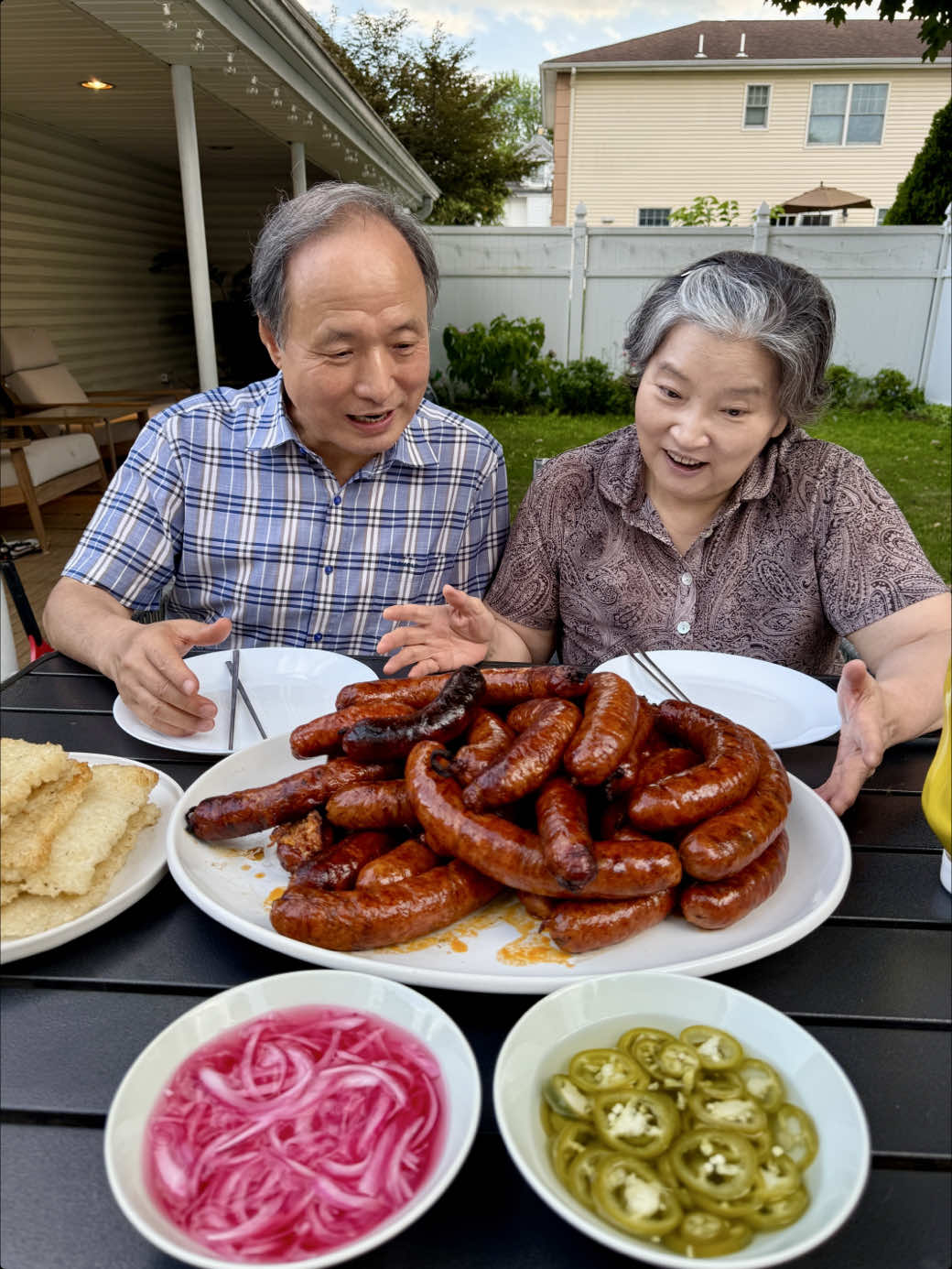 A post by @crazykoreancooking on TikTok caption: See how we made this in previous video. Mom and dad made kimchi cheese sausages. We ate them in scorched rice + sweet rice seaweed roll and also with regular buns. We dressed them with mustard or wasabi, pickled red onions, pickled jalapeños. They were all delicious! #kimchi #sausage #koreanfood #kdrama #mukbang #foodreview
